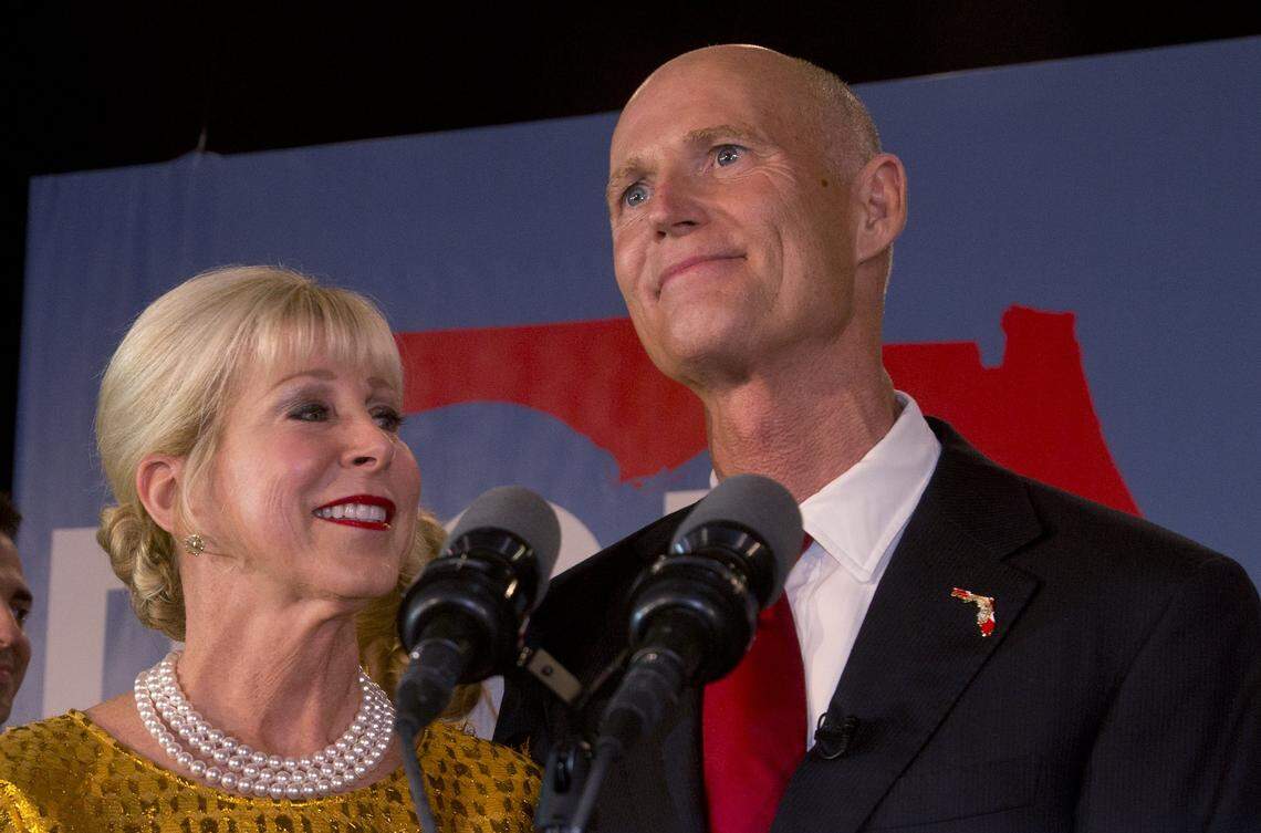 Ann Scott, left, looks up at her husband, Florida Gov. Rick Scott, as he makes a victory speech after defeating Democratic challenger, former Republican Charlie Crist, Tuesday, Nov. 4, 2014, in Bonita Springs, Fla.