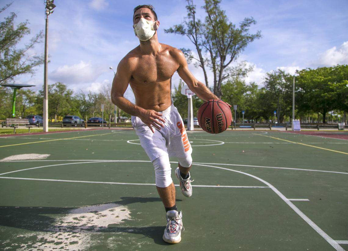 Jonathan Eisenman, 28, plays basketball on the court at Tropical Park. Miami-Dade County lifted its park closure orders due to COVID-19 on April, 29, 2020.