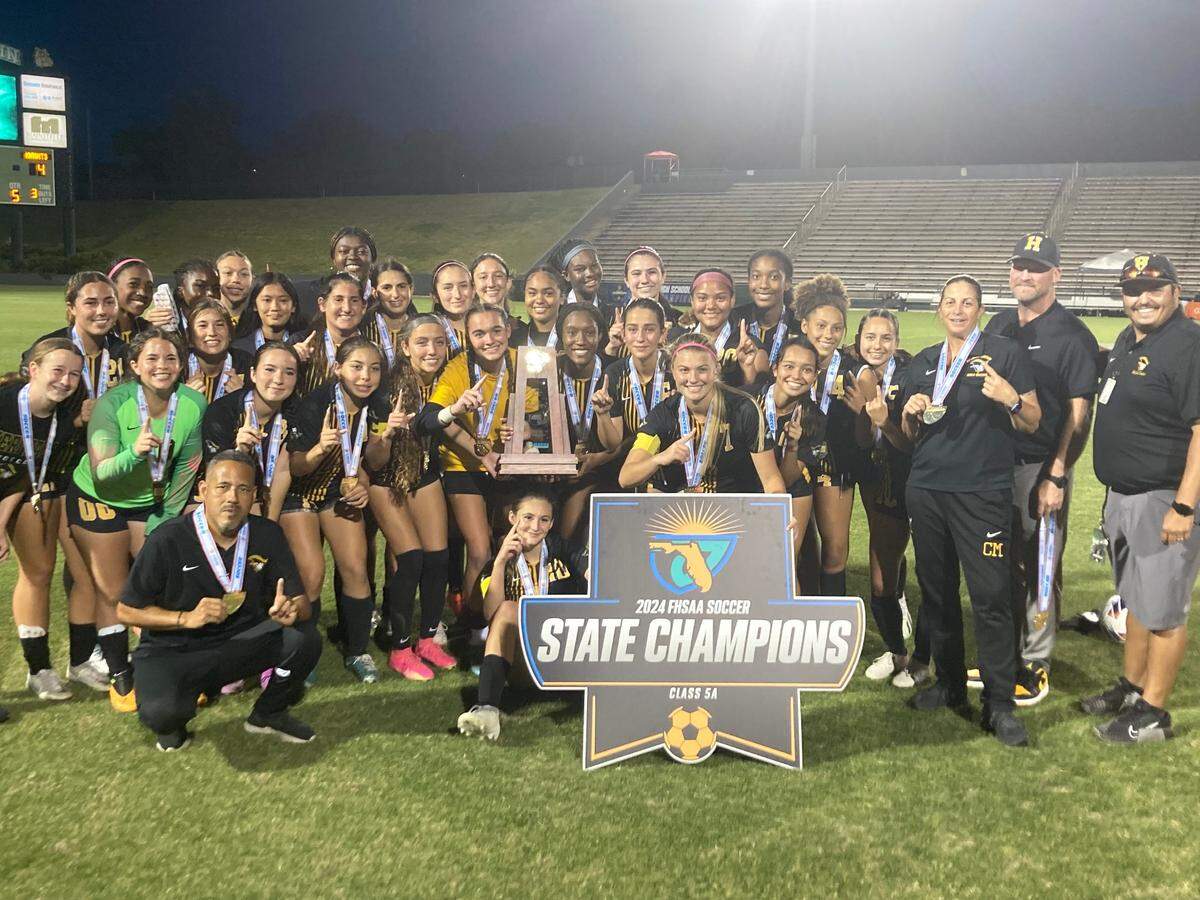 American Heritage girls soccer celebrates Friday night after winning the Class 5A state championship match at Spec Martin Stadium in DeLand, Fla.