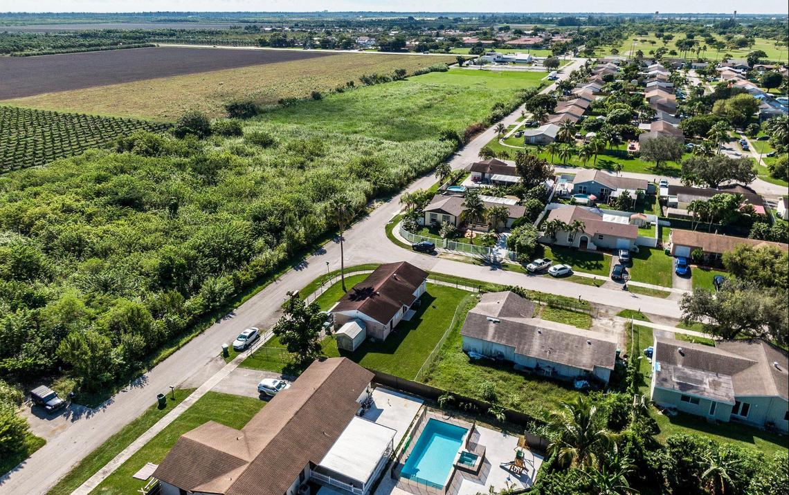 A neighborhood next to an extended farm field located at 26100 SW 112th Ave., Homestead, is included in a plan to expand the Urban Development Boundary by converting farmland into a 9-million-square-foot industrial park near Homestead.