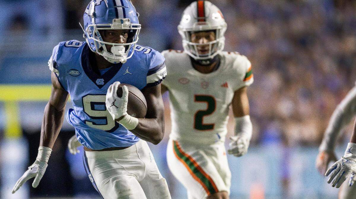 North Carolina wide receiver Devontez Walker (9) scores on an 33-yard pass completion from quarterback Drake Maye to give the Tar Heels a 28-17 lead in the third quarter against Miami on Saturday, October 14, 2023 at Kenan Stadium in Chapel Hill, N.C.