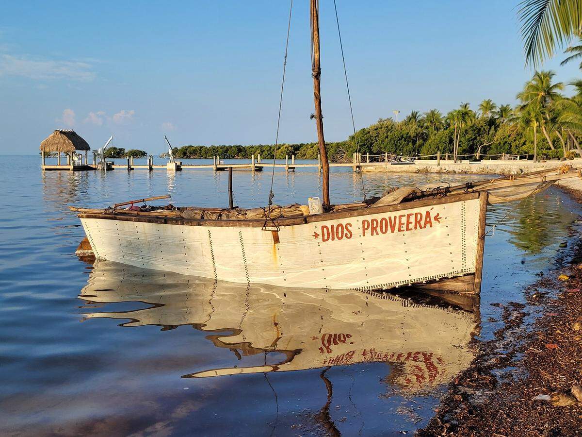 A migrant boat is moored to shore in the Florida Keys Thursday, May 18, 2023.