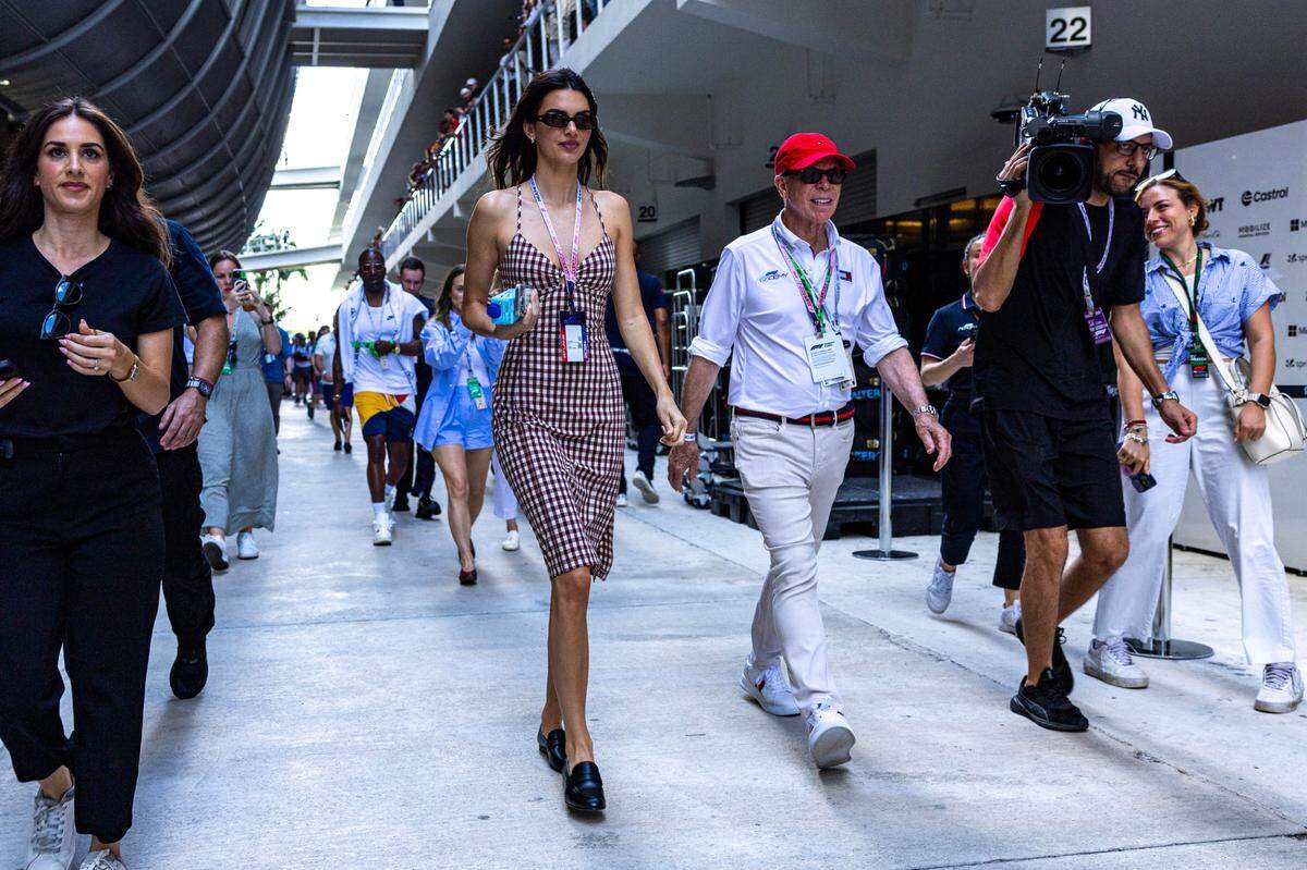 American fashion designer Tommy Hilfiger, right, media personality Kendall Jenner, left, walk through the paddock during day one of Formula One Miami Grand Prix at the Miami International Autodrome on Friday, May 3, 2024, in Miami Gardens, Fla.