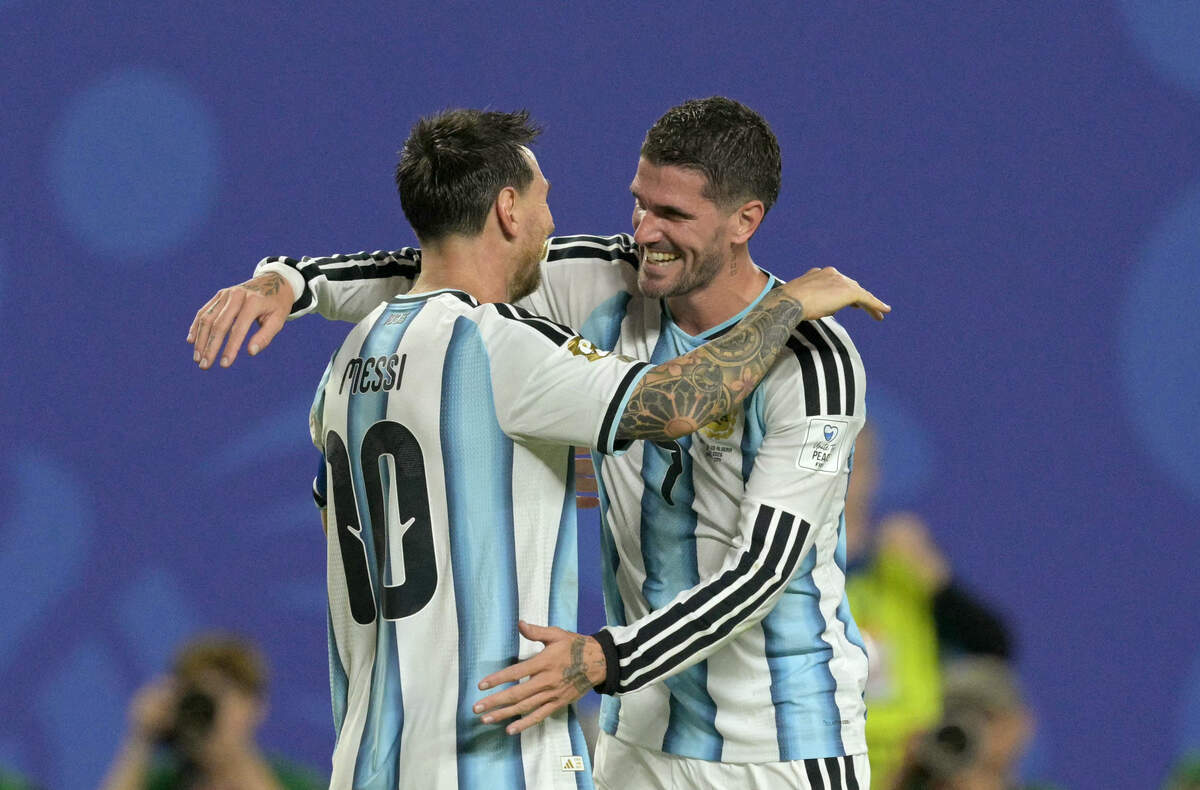 Argentina's forward #10 Lionel Messi celebrates with teammate midfielder #07 Rodrigo De Paul scoring his team's third goal during the 2026 World Cup Group J football match between Argentina and Algeria at the Kansas City Stadium in Kansas City on June 16, 2026.  (Photo by JUAN MABROMATA / AFP via Getty Images)