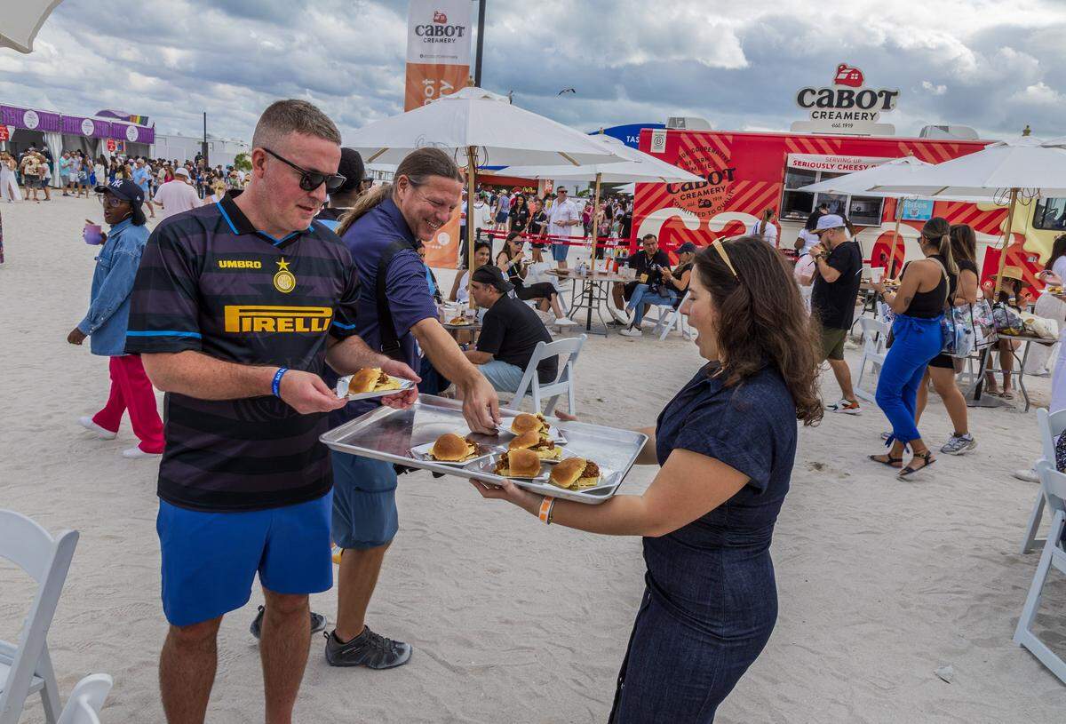 Influencer Alessandra Ciuffo serves bites of “Sloppy Giuseppe’s” during the Grand Tasting Village, SoBe Wine & Food Festival, in Miami Beach, on Saturday, February 22, 2025. 