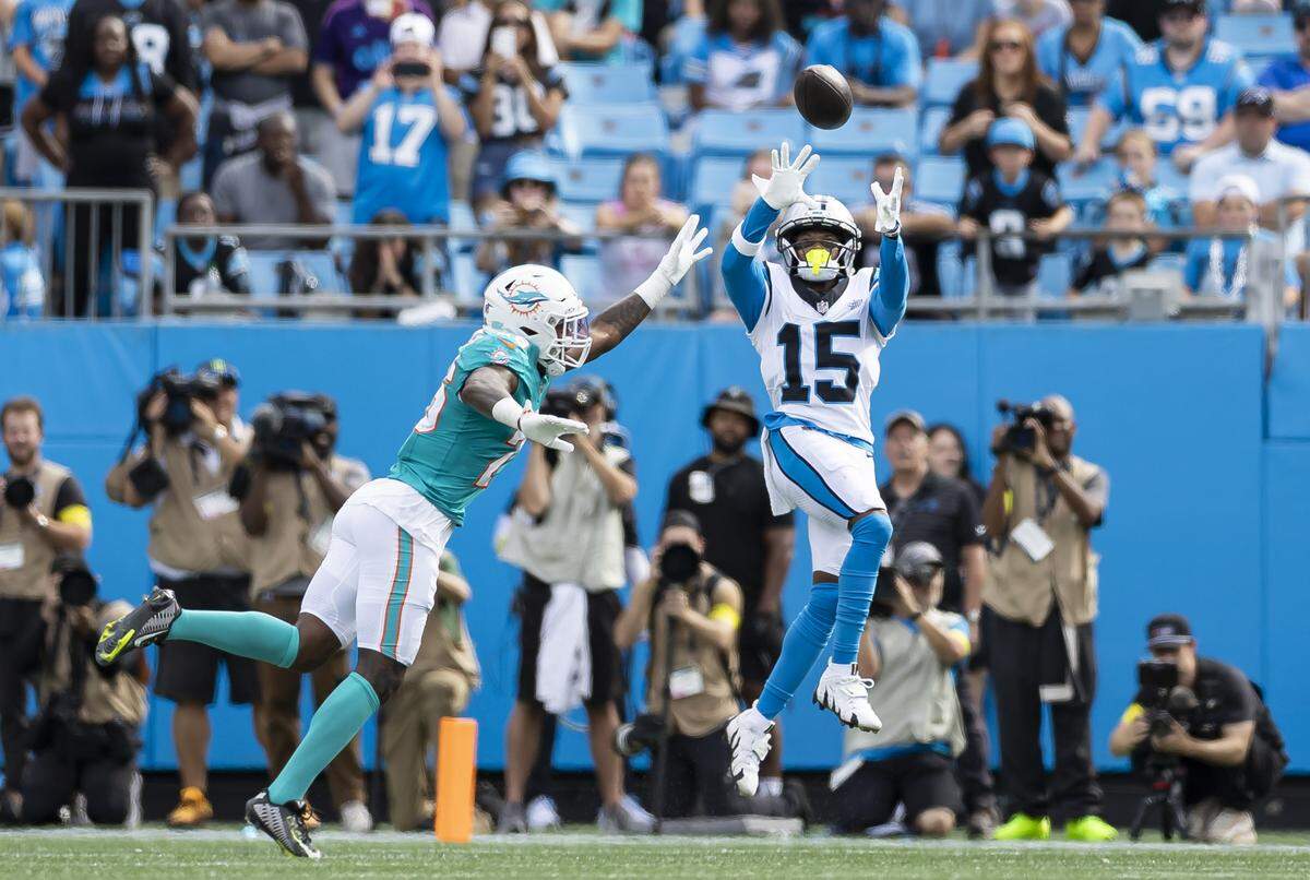 Miami Dolphins cornerback Rasul Douglas (26) fails to stop Carolina Panthers wide receiver Jimmy Horn Jr. (15) from catching a pass in the second half of their NFL game at the Bank of America Stadium on Sunday, Oct. 5, 2025, in Charlotte, N.C.