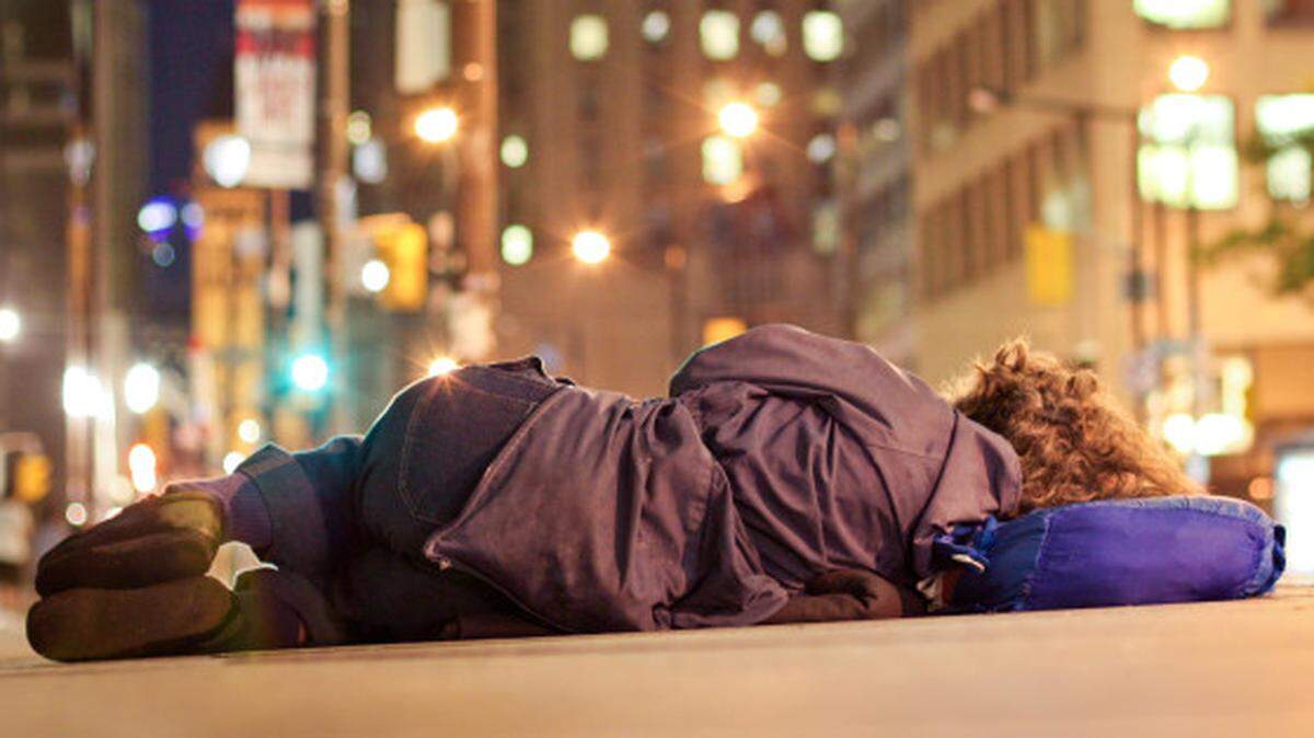 Man sleeping on road