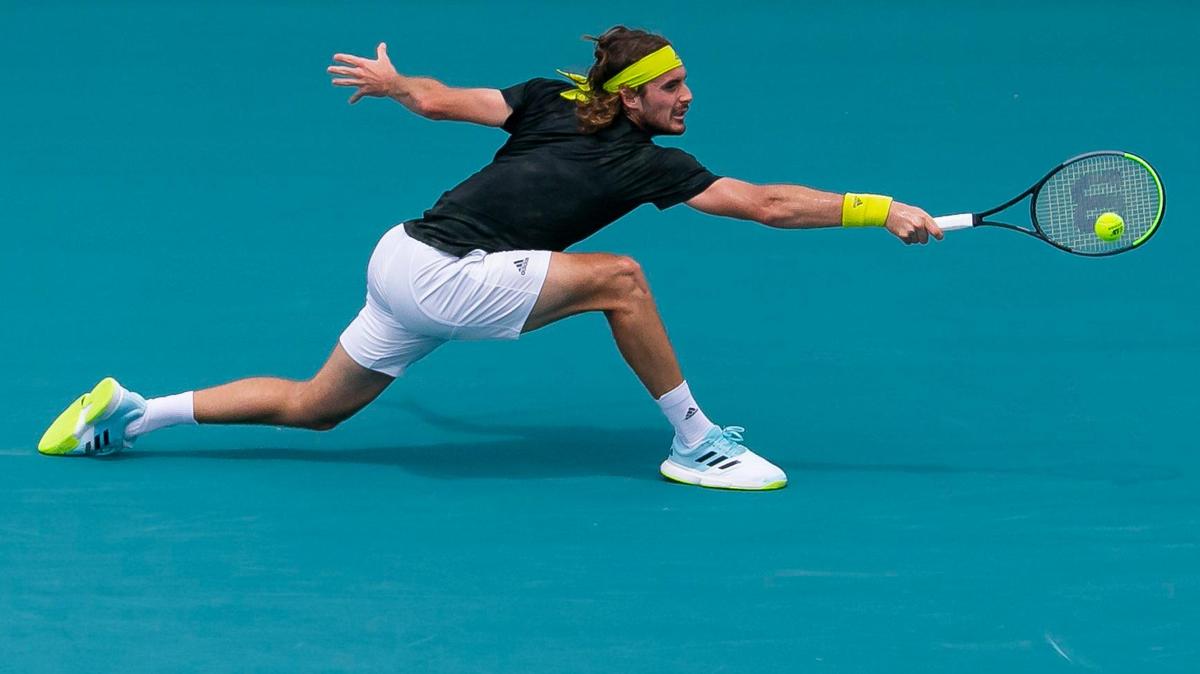 Stefanos Tsitsipas of Greece returns a shot to Hubert Hurkacz of Poland during their match at the Miami Open tennis tournament on Thursday, April 1, 2021 at Hard Rock Stadium in Miami Gardens, Florida.