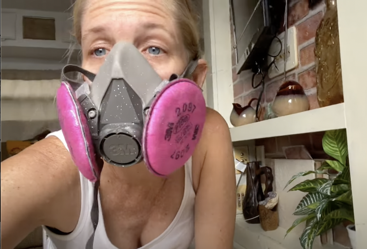 Jessica Dobbins speaks to the camera in a YouTube video as she repairs her camper that was damaged after Hurricane Ian.