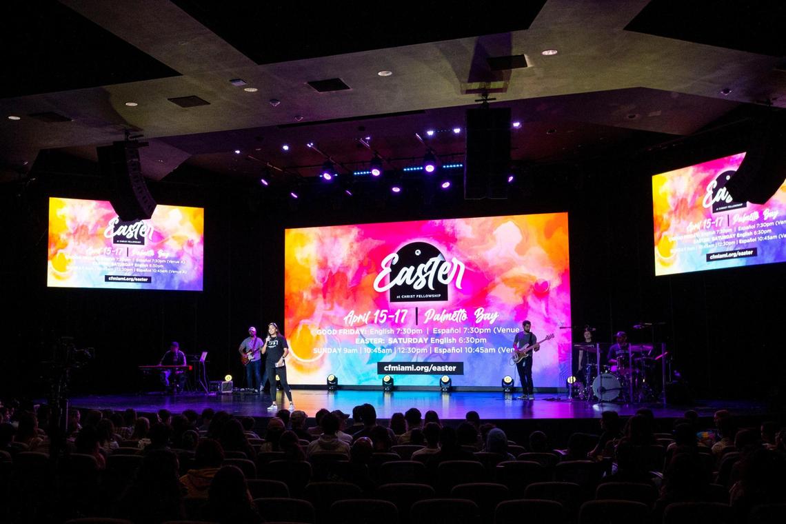 Host Elena Watkins speaks to congregants during a CF Students worship service at Christ Fellowship Church in Palmetto Bay, Florida, on Friday, April 8, 2022.
