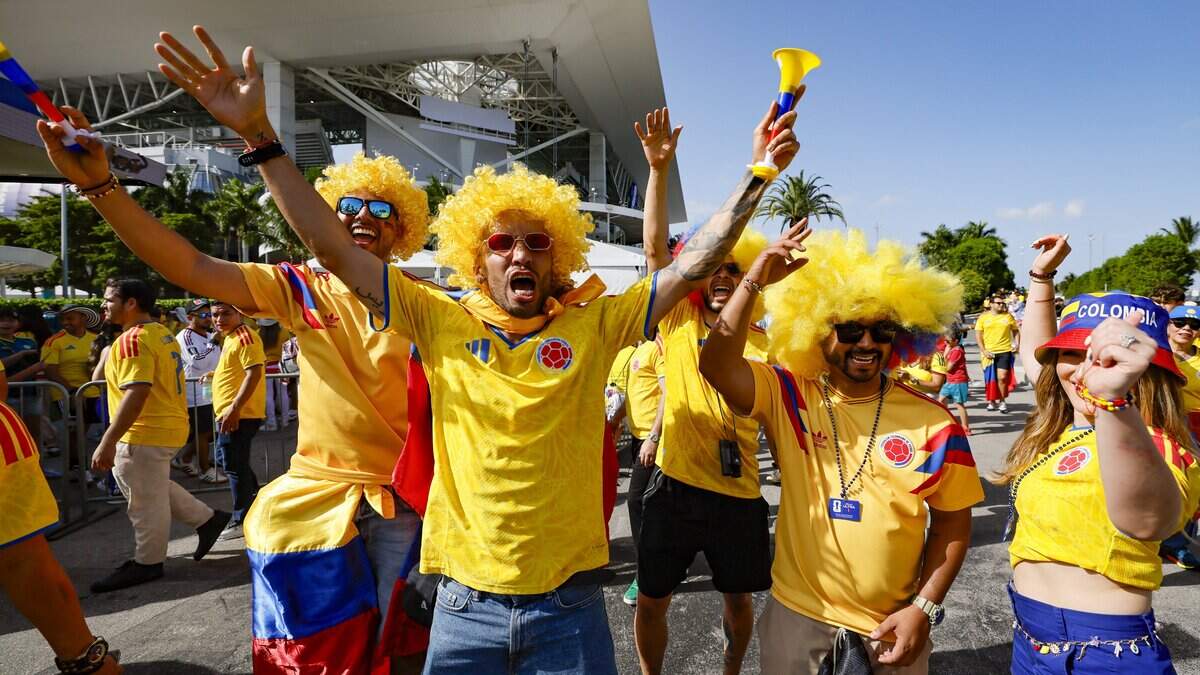 Walter Escobar and friends react as they arrive for the start of the World Cup Group K soccer match beween Colombia and Portugal at Hard Rock Stadium (Miami Stadium) in Miami Gardens, Florida on Saturday, June 27, 2026.
