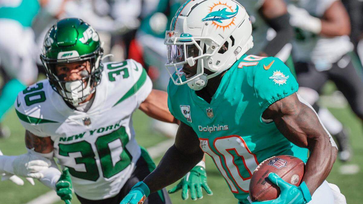 Miami Dolphins wide receiver Tyreek Hill (10) on a pass reception in the first half against the New York Jets at MetLife Stadium in in East Rutherford, New Jersey on Sunday, October 9, 2022.
