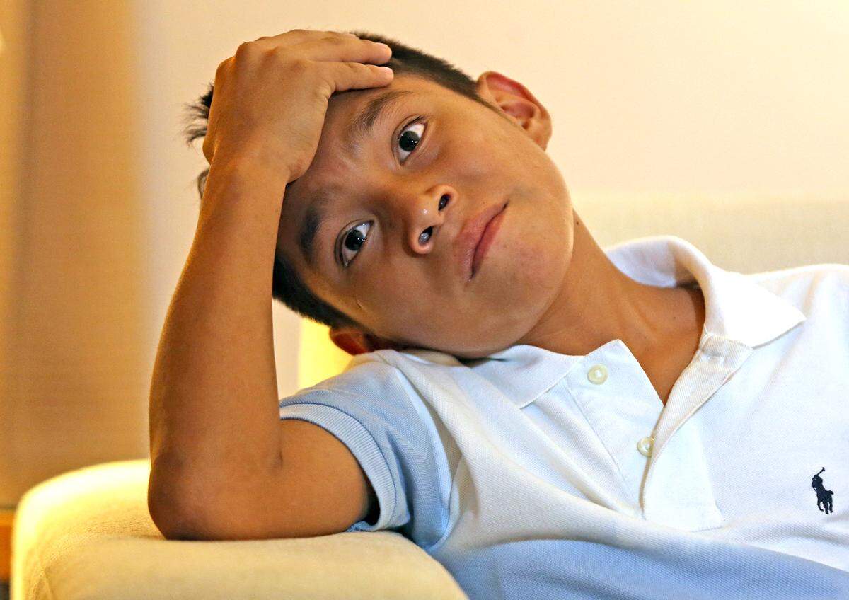 Geremy, an 11-year-old boy talks to the media after he was reunited with his mother after being separated for two months in May, July 16, 2018. The family is now suing the U.S. government after they say the boy was bullied in the Chicago shelter. HIs injuries were so bad that his head was “cracked open” and he needed staples.