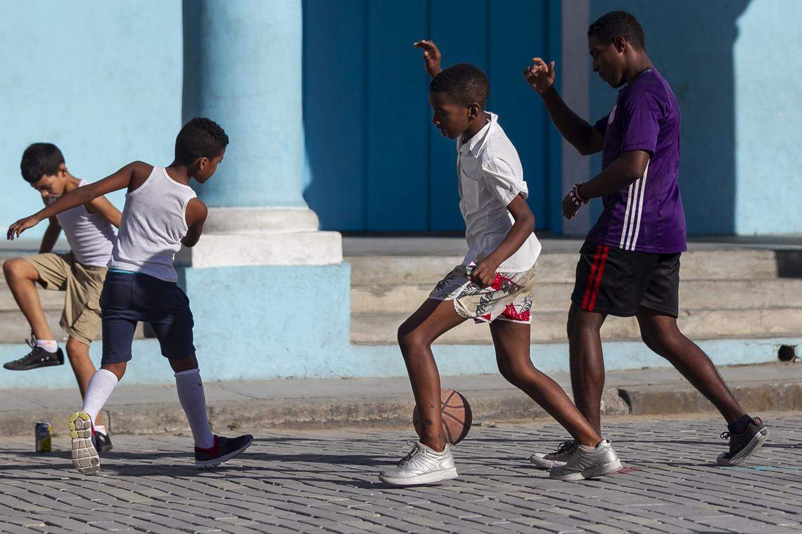 A basketball is used for an impromptu soccer game in Old Havana, Cuba.