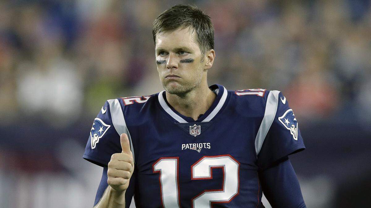 In this Aug. 16, 2018, file photo, New England Patriots quarterback Tom Brady signals a thumbs-up on the sideline during the second half of a preseason NFL football game against the Philadelphia Eagles in Foxborough, Mass. Six-time Super Bowl champion Tom Brady has signed a two-year contract with the Tampa Bay Buccaneers, saying he is embarking on a “new football journey.” The 42-year-old quarterback who spent the first 20 years of his career with the New England Patriots announced his decision Friday, March 20, 2020, in an Instagram post and thanked the Bucs for the opportunity.