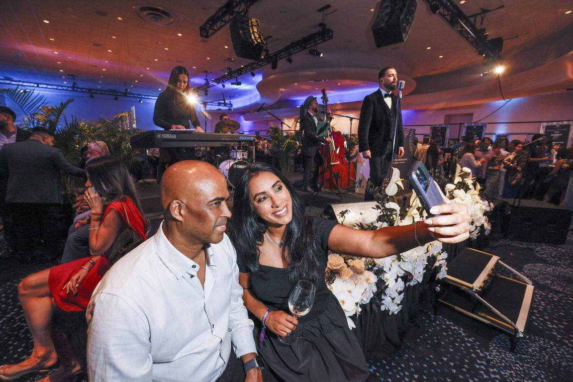 Aman Sarkaria takes a selfie with Craig Richey as singer Daniel Marzoa performs while the Fontainebleau Miami Beach presents Wine Spectator's Best of the Best with 60 of the nation’s most acclaimed chefs and more than 65 of the world’s premier wineries at the resort hotel on Friday, February 20, 2026.