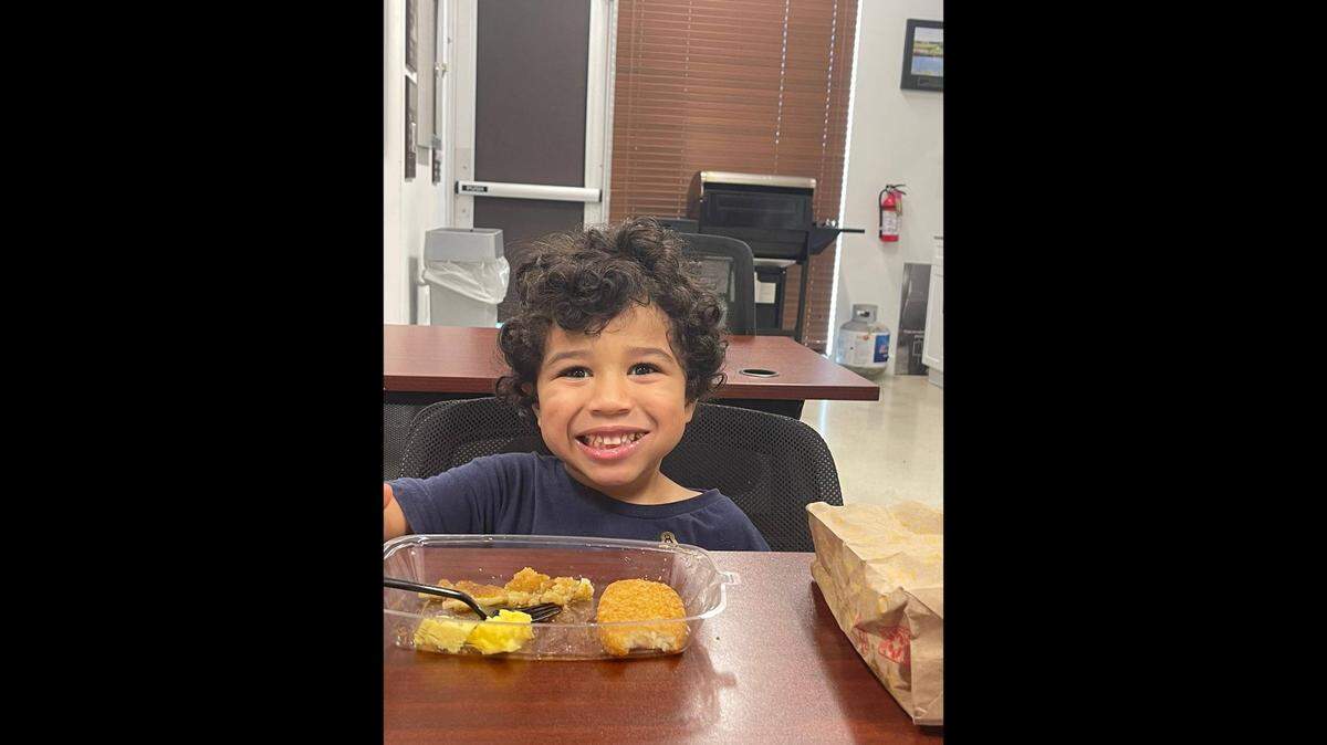 The boy who calls himself “Jayden” chowing down on eggs and a hash brown at a Broward Sheriff’s Office station.