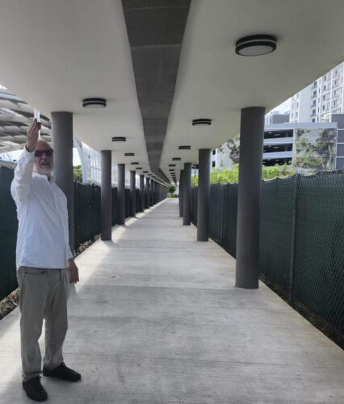 Gustavo Matamoros inspects his work, a unique walkway sound experience for a new housing development, Quail Roost Station in Cutler Bay.