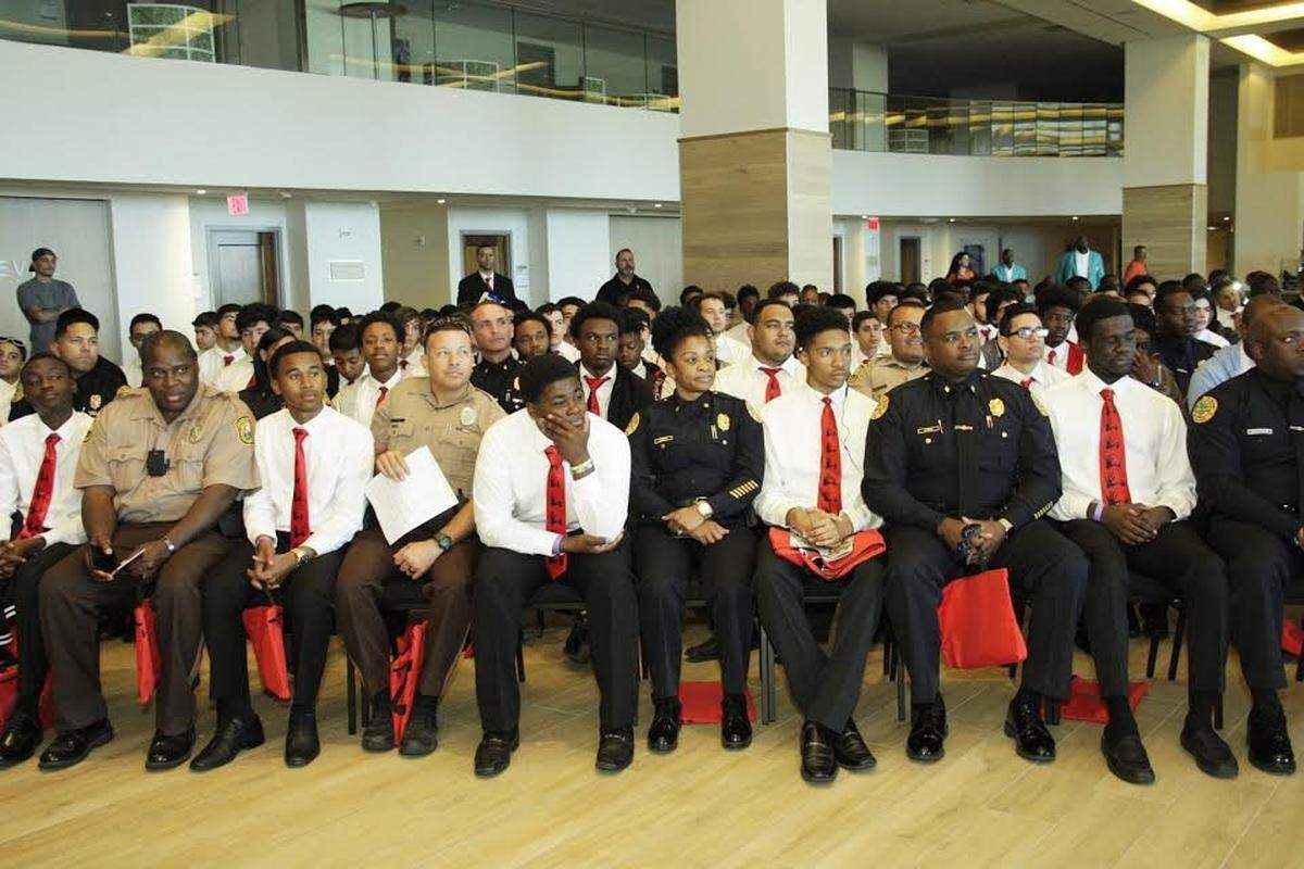 In 1995, black teens and police came together at one of the early 5000 Role Models conferences to learn more about each other.