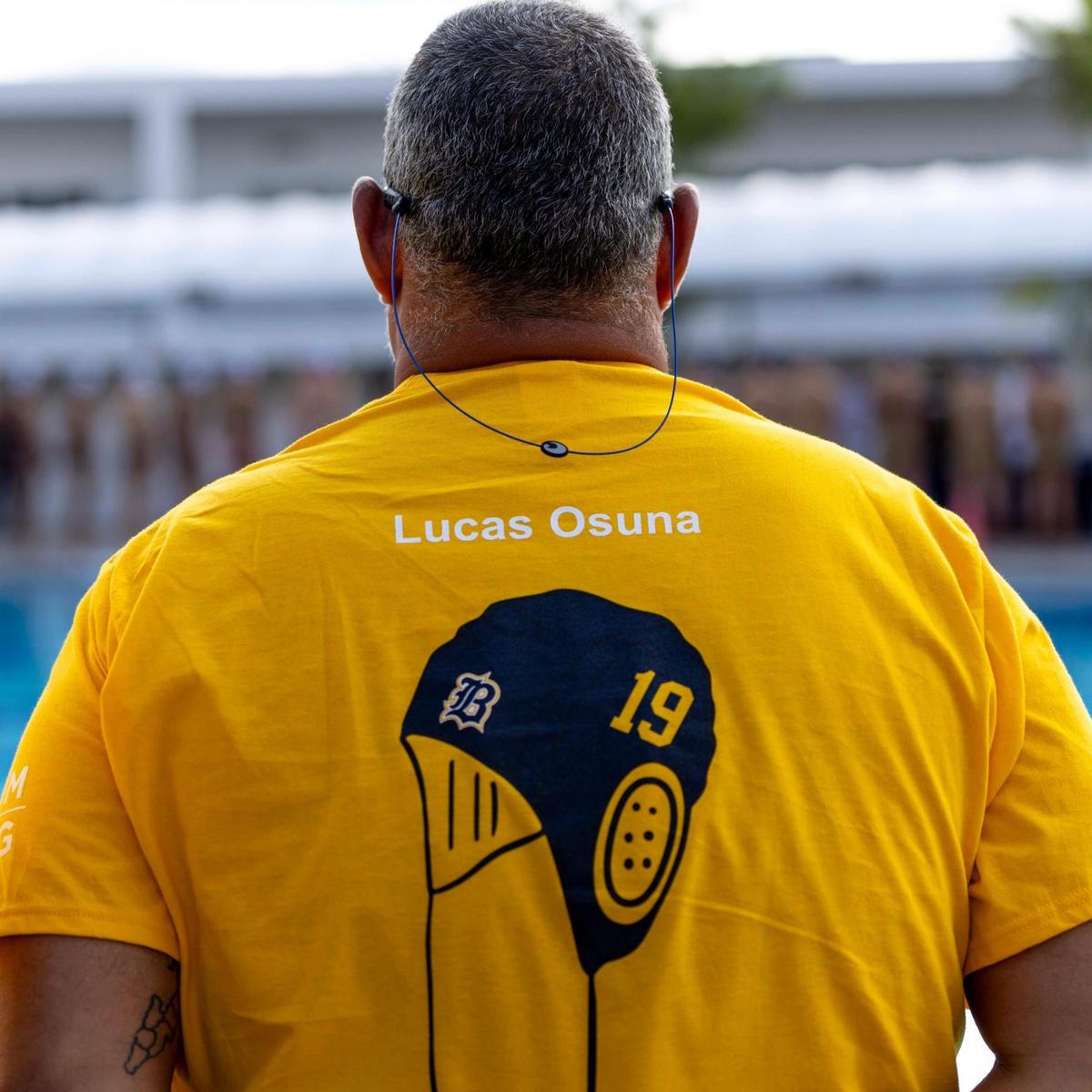 Miami, Florida, April 8, 2025 - Belen’s boys Water Polo head coach Jimmy Aguilera wears a #19 Lucas Osuna shirt in memory of Lucas Osuna during a match against Coral Gables High at Gulliver Prep.