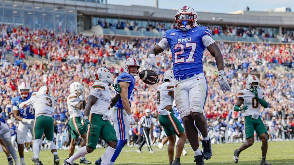 Southern Methodist University Mustangs running back T.J. Harden (27) celebrates after scoring in overtime to defeat the Canes during an NCAA football game at Gerald Ford Stadium on Saturday, November 1, 2025, in Dallas, Texas.