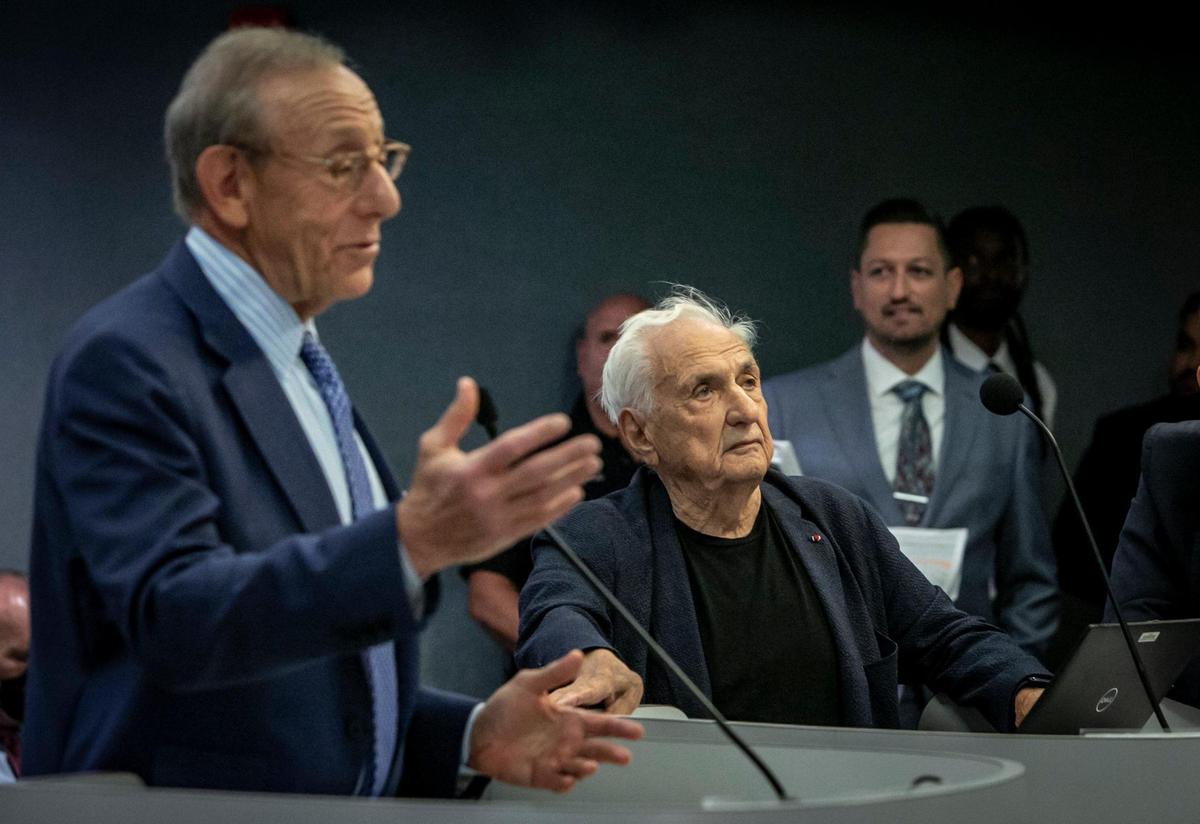 Dolphins owner Stephen Ross, left, speaks to the Miami Beach City Commission as architect Frank Gehry listens before the start of a presentation regarding the Deauville site on July 20, 2022.