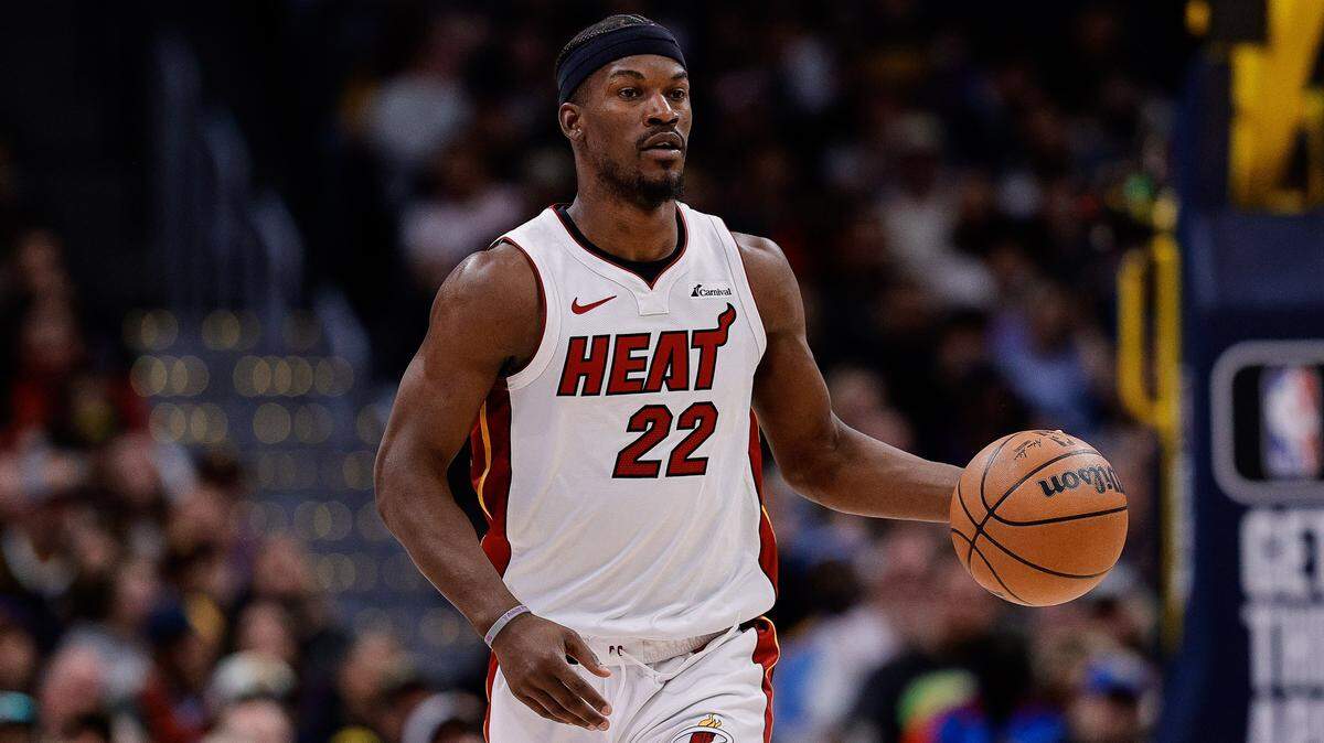 Miami Heat forward Jimmy Butler (22) dribbles the ball up court in the fourth quarter against the Denver Nuggets at Ball Arena.
