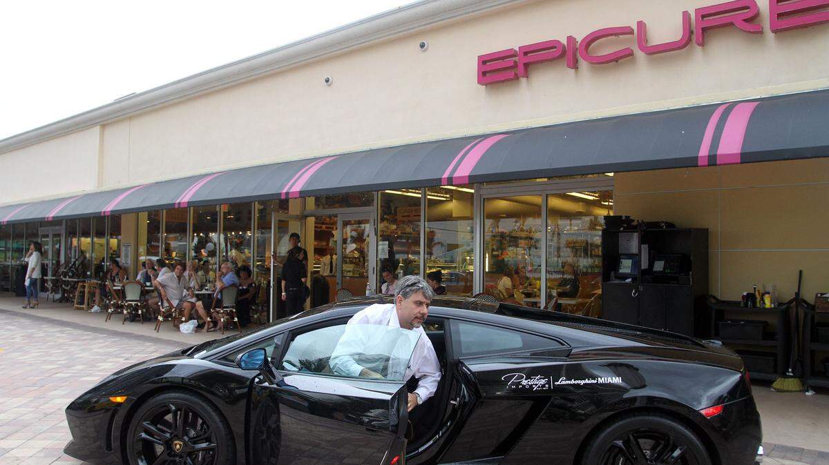 Dominick Raneri, finance director at Prestige Imports, parks a Lamborghini at Epicure Sunny Isles Beach for a car event in 2011.