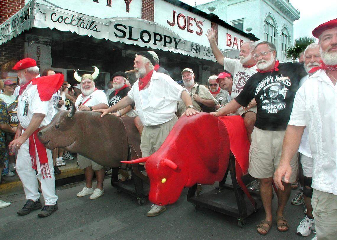 Ernest Hemingway Look-Alikes parade down Duval Street during Key West’s version of the “Running of the Bulls” at the 2001 Hemingway Days Festival.