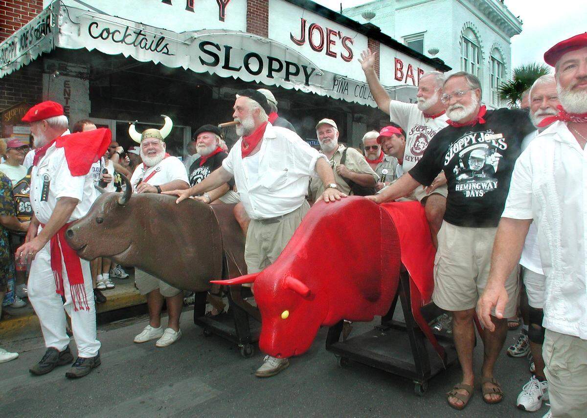Ernest Hemingway Look-Alikes parade down Duval Street during Key West’s version of the “Running of the Bulls” at the 2001 Hemingway Days Festival.