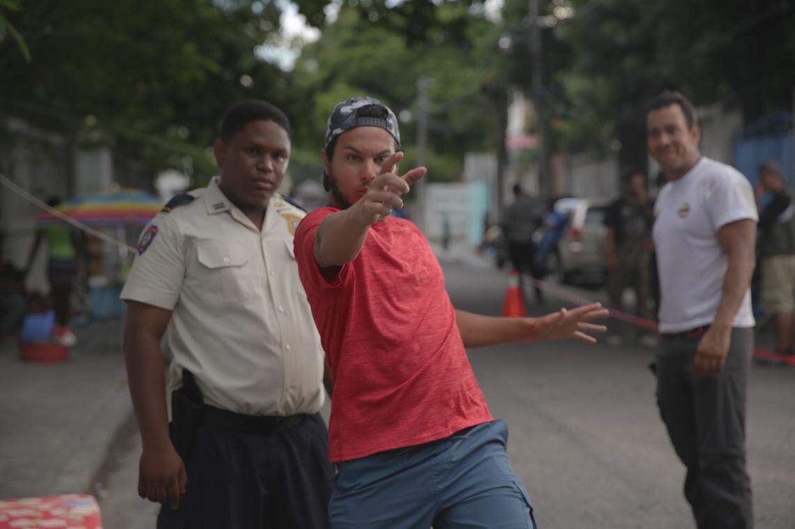 David Pierre Etienne, left, receives instructions from Ricardo Valderrama on how to perform a stunt during the filming of Kidnapping Inc., a dark comedy and political thrilled filmed in Haiti.