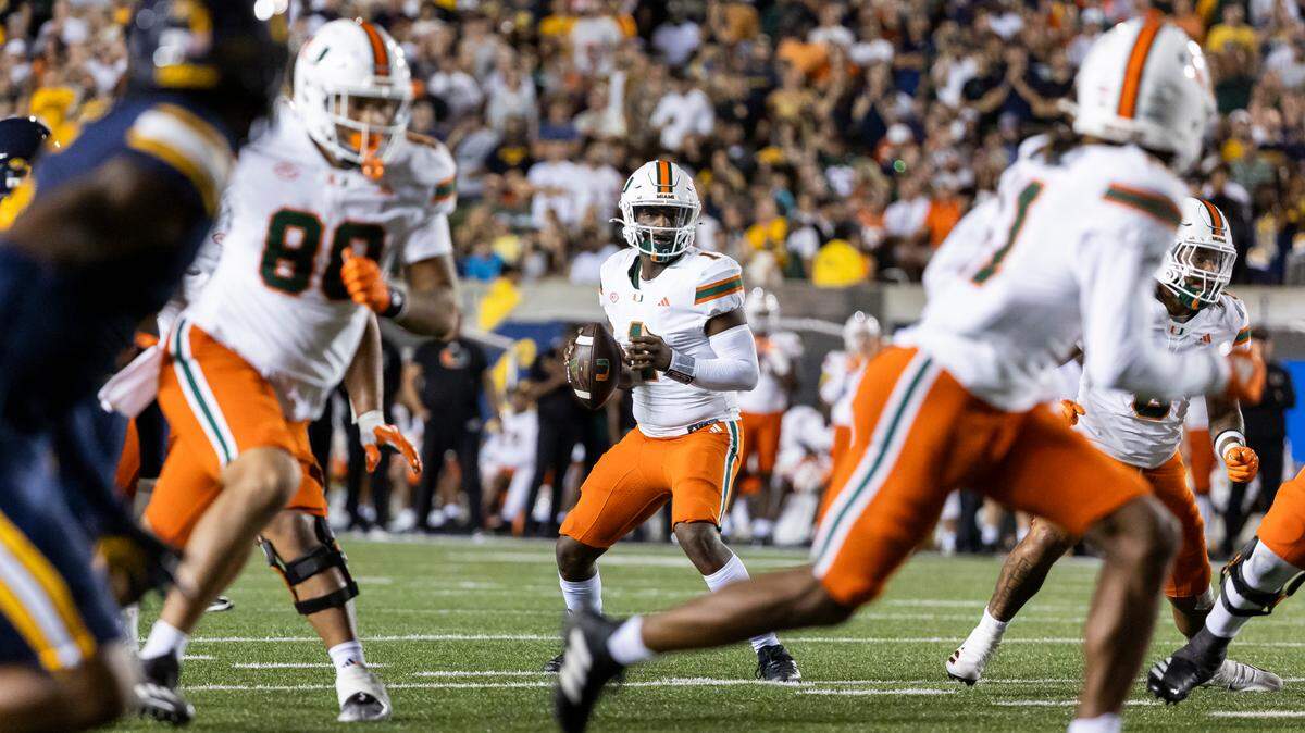 Miami Hurricanes quarterback Cam Ward (1) looks to pass the ball in the second half of his NCAA college football game against the California Golden Bears at the California Memorial Stadium on Saturday, Oct. 5, 2024, in Berkeley, Calif.