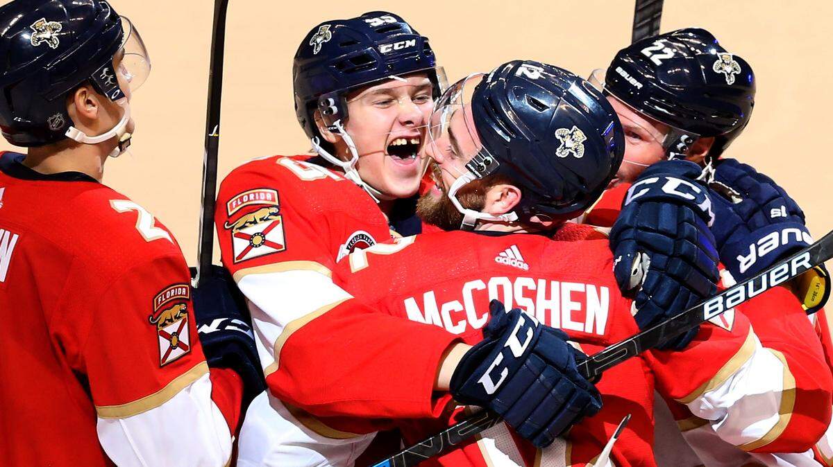 Florida Panthers Henrik Borgstrom (95) grabs Ian McCoshen (12) after McCoshen scored the Cat’s sixth goal of the game in the third period as they play the Los Angeles Kings at the BB&T Center in Sunrise, Florida, Saturday, February, 23, 2019.
