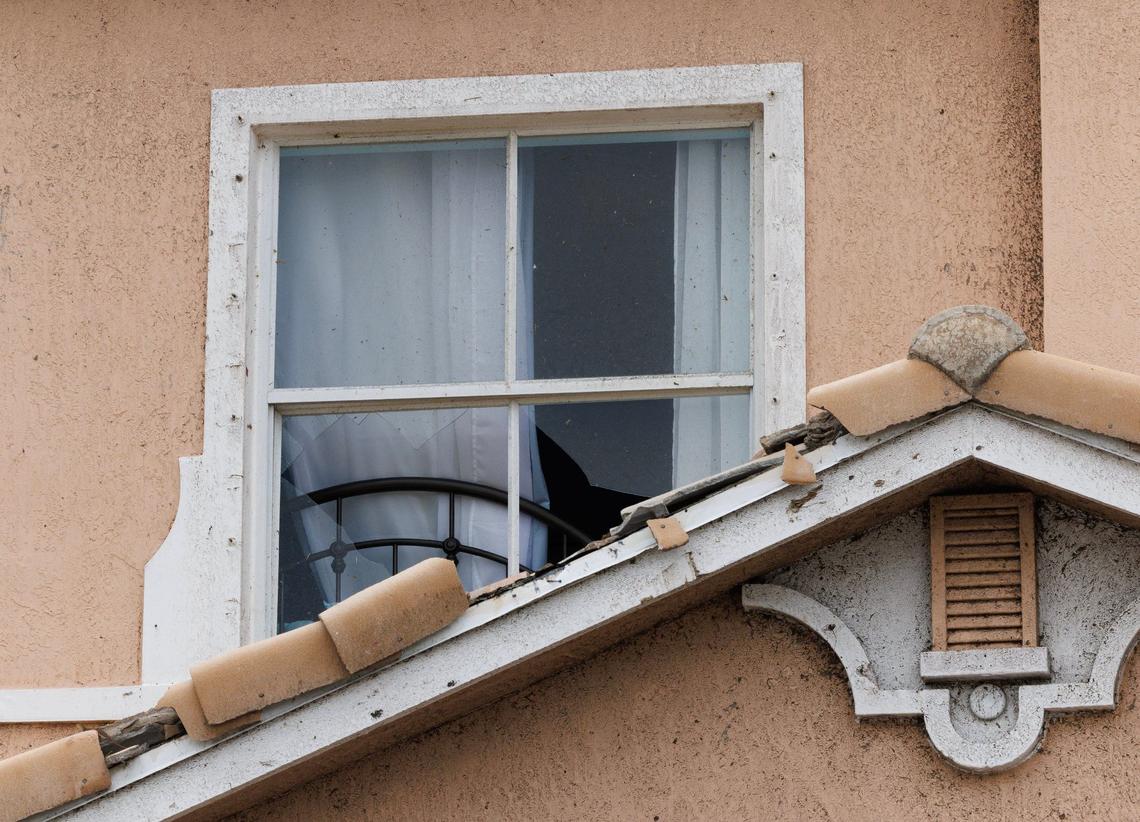 View of a broken window damaged by a pair of tornadoes that tore through the Portofino Shores Community in St. Lucie County, hours before Hurricane Milton slammed into Florida’s west coast on Wednesday, Oct. 9, 2024.