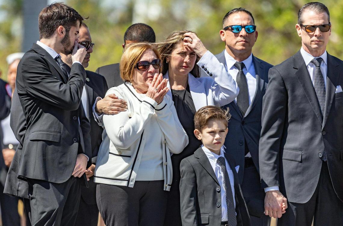 Chacha Reyes, the wife of Miami City Commissioner Manolo Reyes, who died on Thursday, and family members watch the proceedings during a memorial service at Miami City Hall on Wednesday, April 16, 2025.