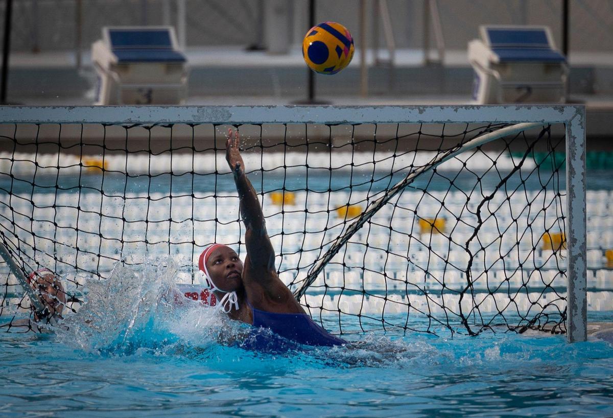 Ashleigh Johnson, 1, Team USA water polo goalkeeper, practices in the pool with the rest of the team on Tuesday, Dec. 5, 2023, at Ransom Everglades High School in Coconut Grove. Team USA has been training at Ransom in preparation for their upcoming matches that week against Spain.