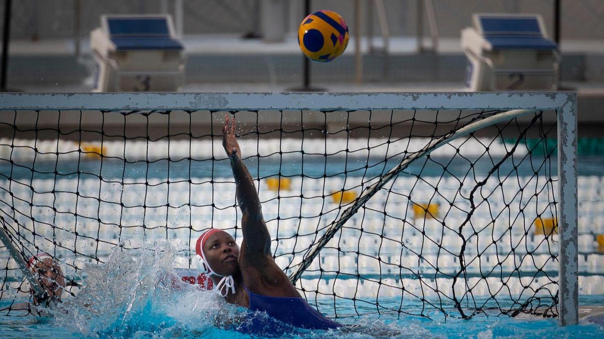 Ashleigh Johnson, 1, Team USA water polo goalkeeper, practices in the pool with the rest of the team on Tuesday, Dec. 5, 2023, at Ransom Everglades High School in Coconut Grove. Team USA has been training at Ransom in preparation for their upcoming matches that week against Spain.