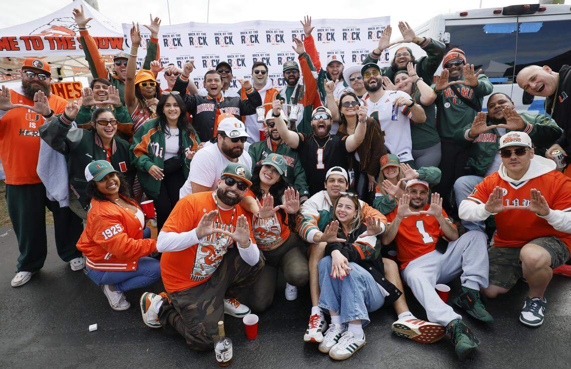 Miami Hurricanes fans react during a tailgate party before the College Football Playoff National Championship Game between the Miami Hurricanes and the Indiana Hoosiers at Hard Rock Stadium in Miami Gardens, Florida, on Monday, January 19, 2026.