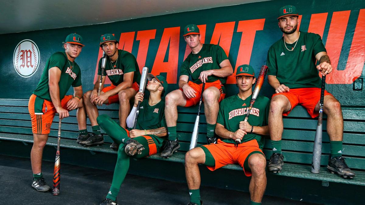 Miami Hurricanes home-run hitters Blake Cyr, Yohandy Morales, Carlos Perez, Zach Levenson, Dominic Pitelli, and CJ Kayfus, pose in the dugout at Mark Light Field at Alex Rodriguez Park in Coral Gables, Florida on Wednesday, May 17, 2023.