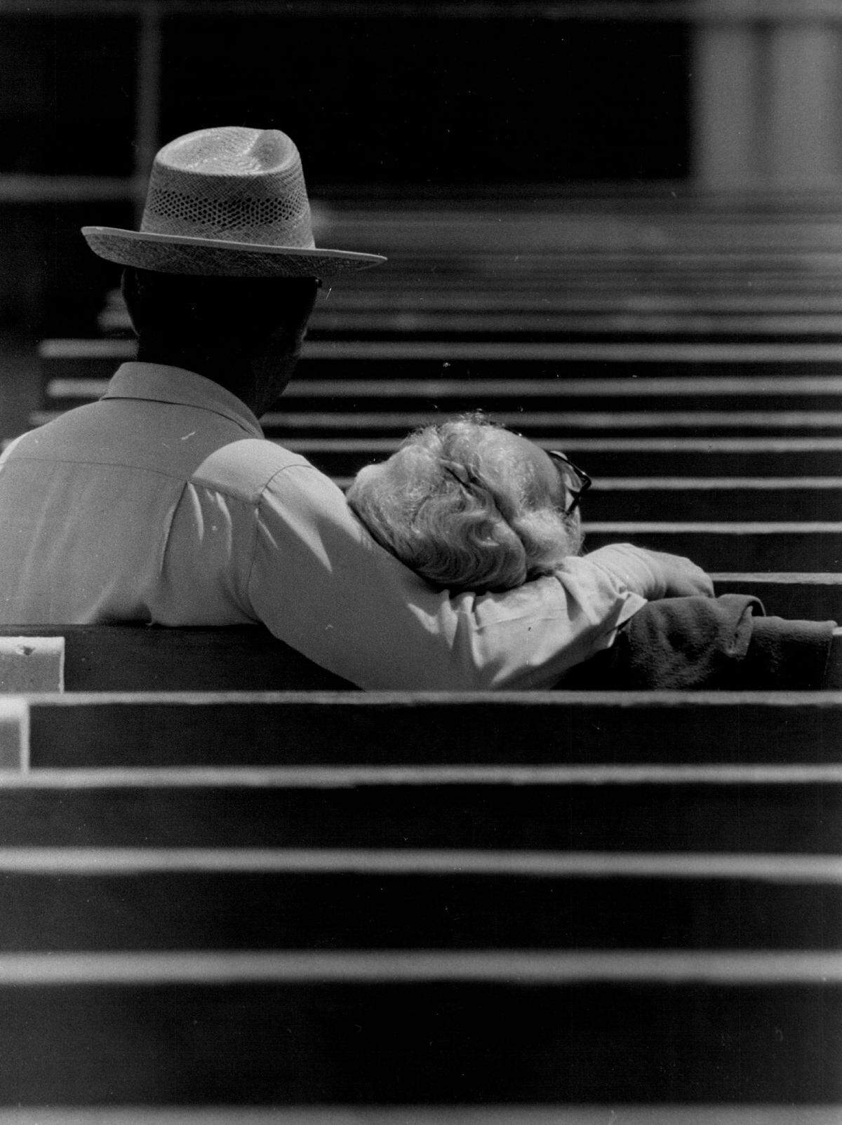 An older couple on a bench at Friendship Corner in South Beach.