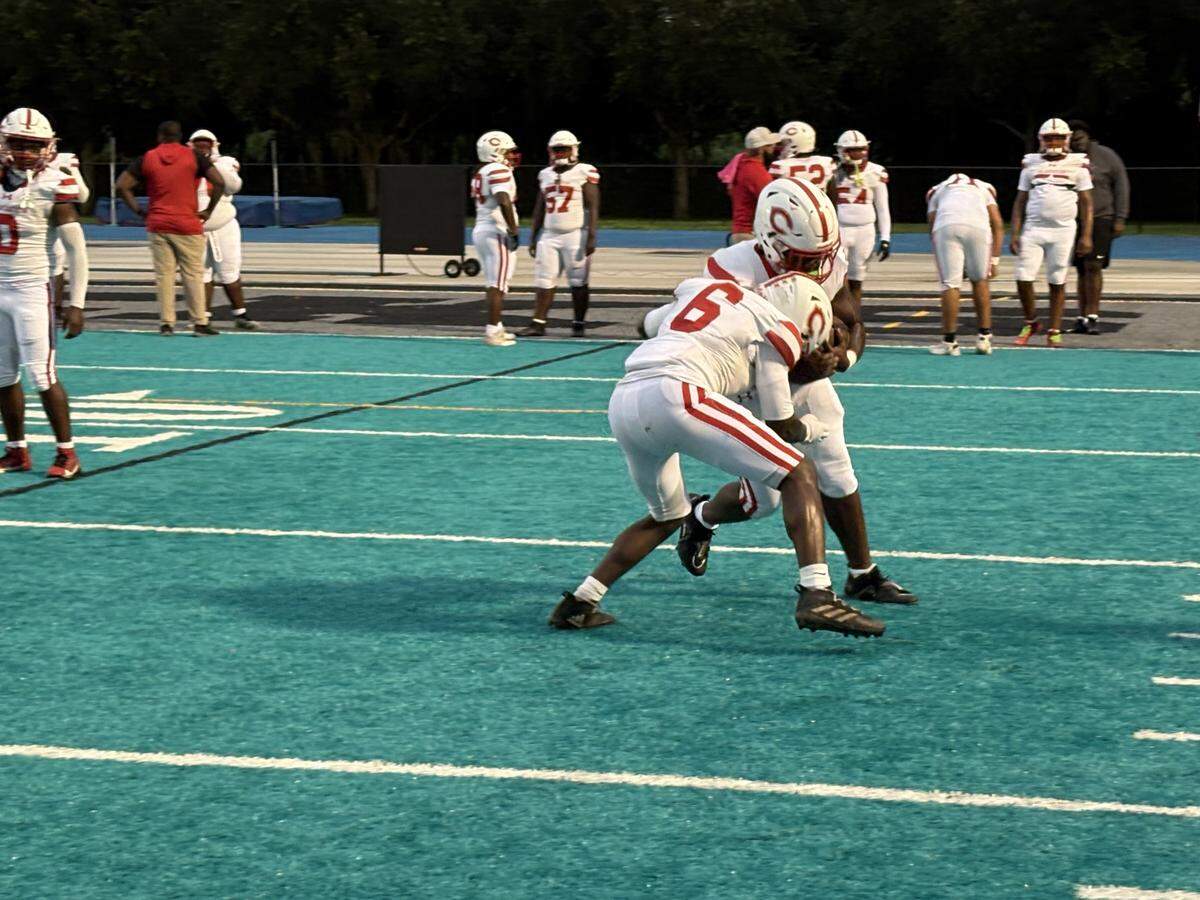 Plantation players warm up before their game against Archbishop McCarthy on Friday at the Mavericks’ home field.
