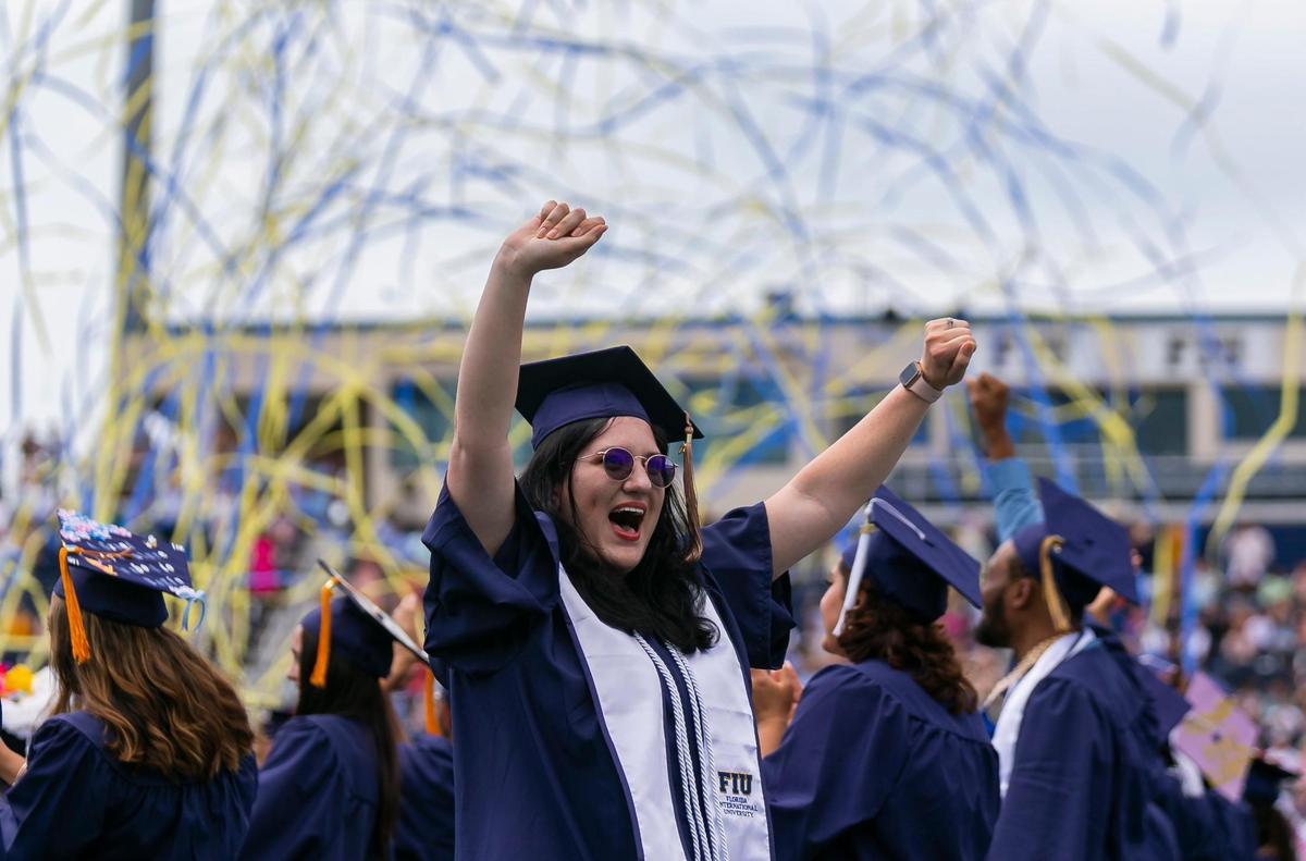 A Florida International University student reacts during her graduation ceremony inside FIU’s Riccardo Silva Stadium in Miami, Florida on Saturday, April 30, 2022.
