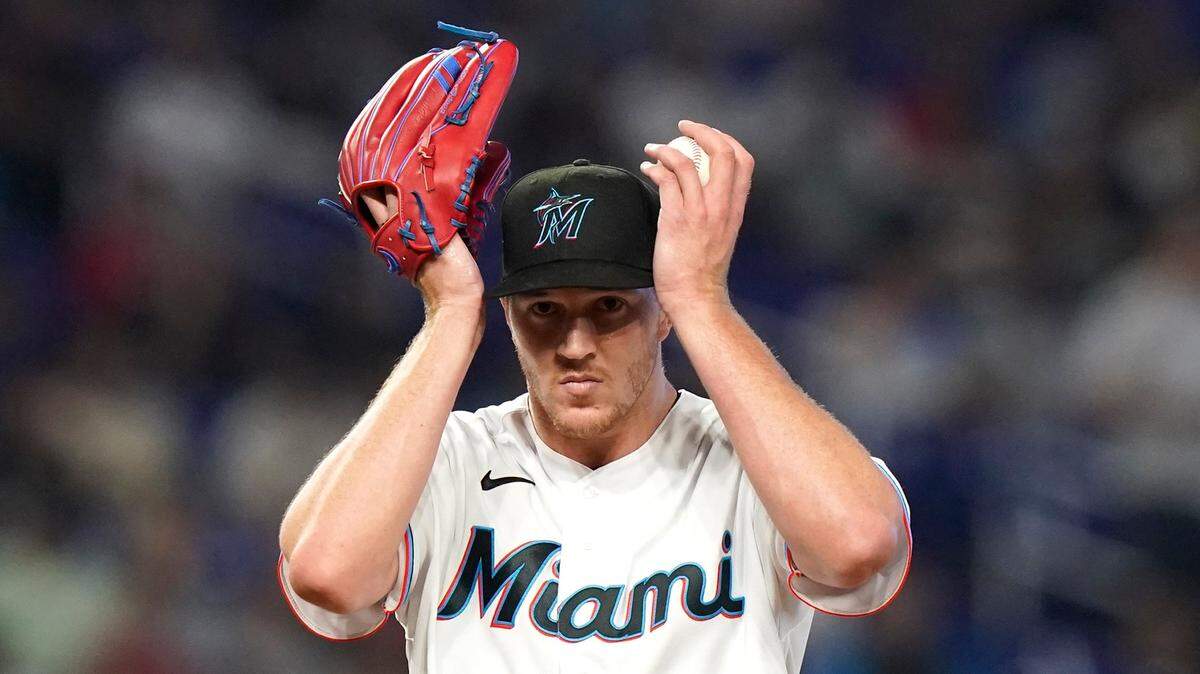 Miami Marlins starting pitcher Trevor Rogers adjusts his cap during the first inning of a baseball game against the Philadelphia Phillies, Saturday, April 16, 2022, in Miami. (AP Photo/Lynne Sladky)