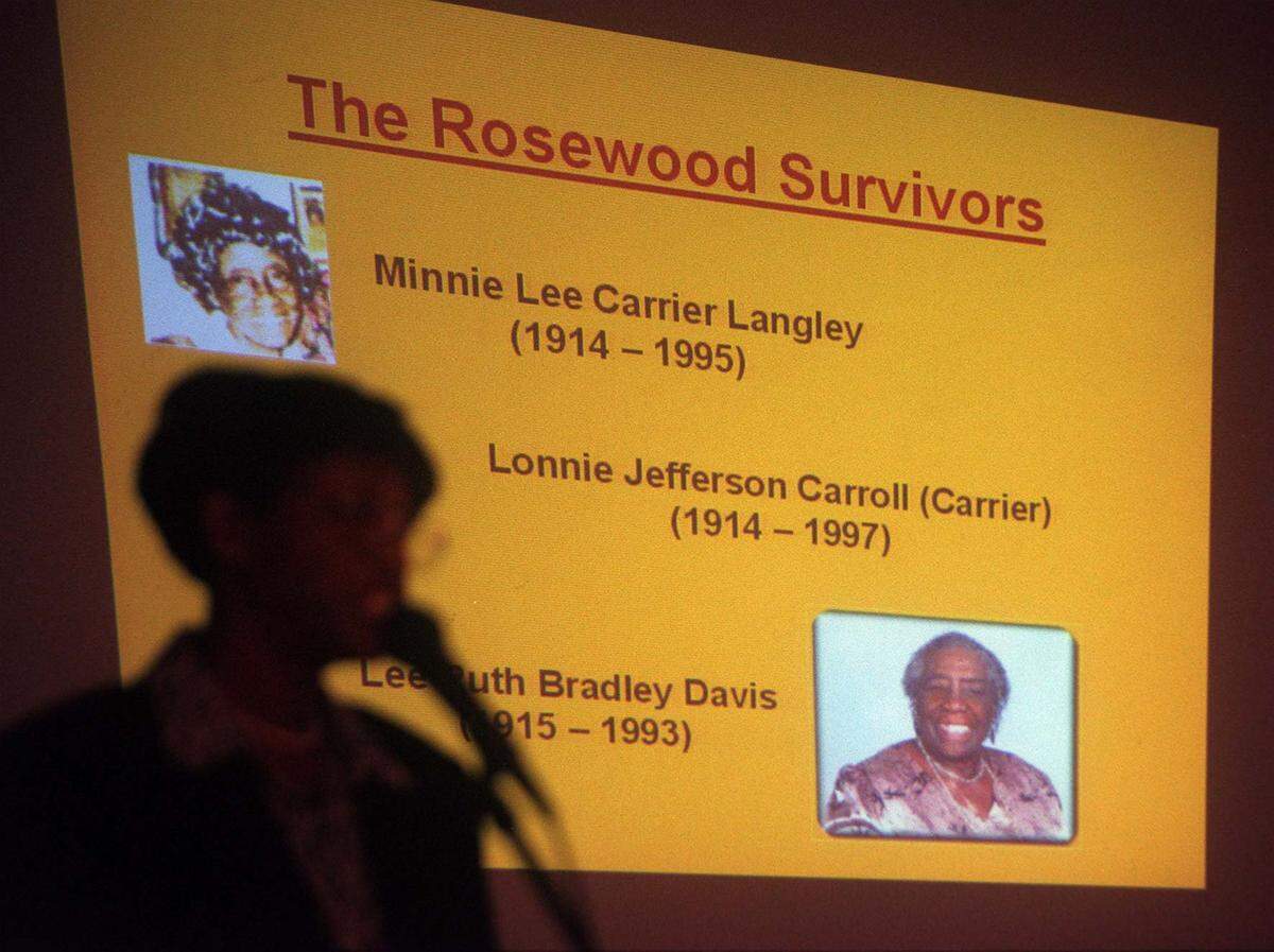 Annette G. Shakir, daughter of a survivor of the Rosewood massacre speaks about the Rosewood and other survivors, in Jefferson Reaves Park, Brownsville, on Feb. 4, 2001..