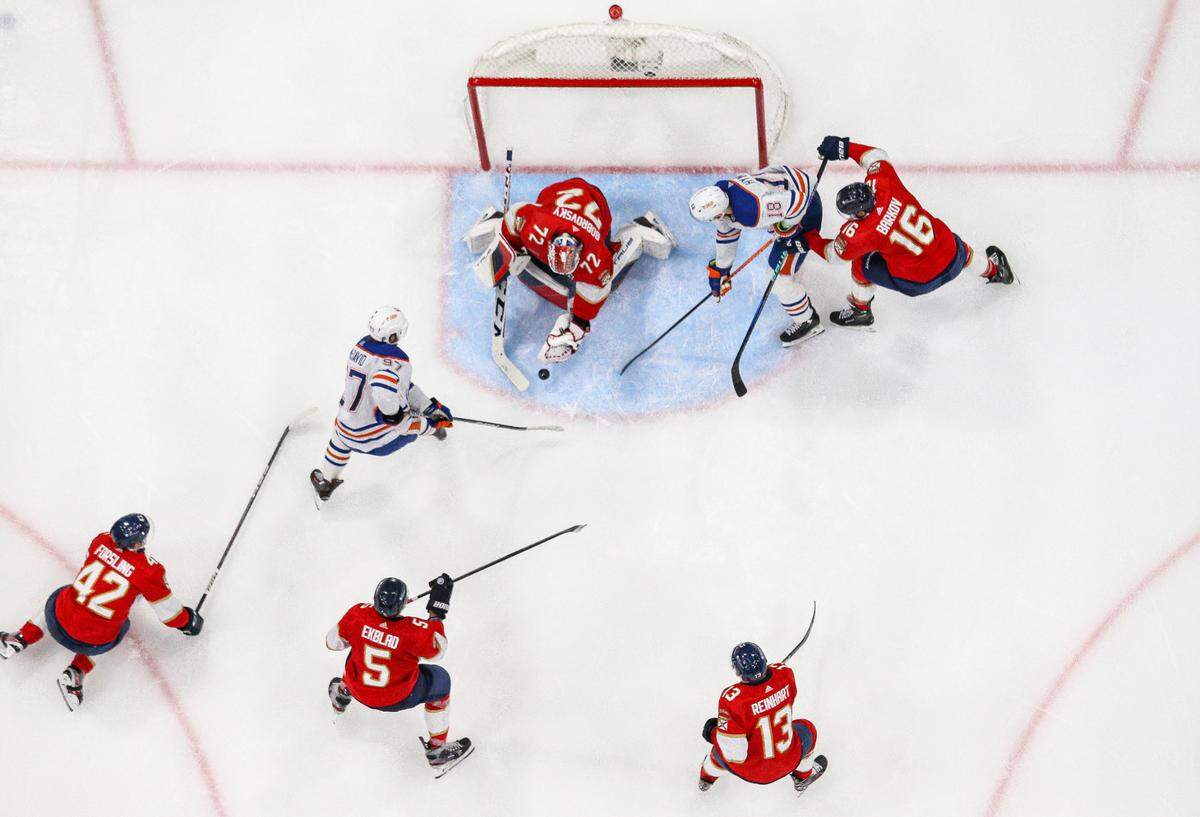Florida Panthers goaltender Sergei Bobrovsky (72) blocks a shot by Edmonton Oilers center Connor McDavid (97) in the second period of Game 1 of the NHL Stanley Cup Finals at the Amerant Bank Arena on Saturday, June 8, 2024, in Sunrise, Fla.
