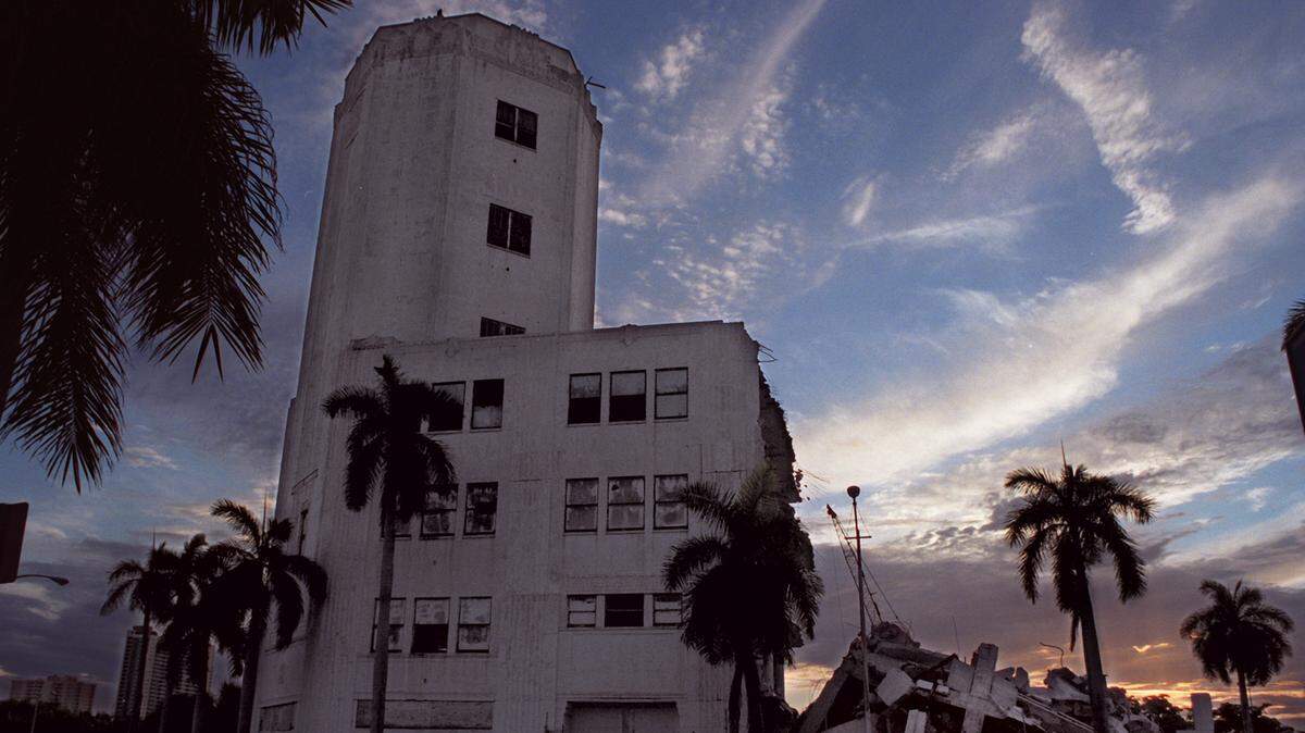 In this 2001 file photo, the Sears Tower in downtown Miami remains standing as demolition continues, making way for the future performing arts center on Biscayne Boulevard.