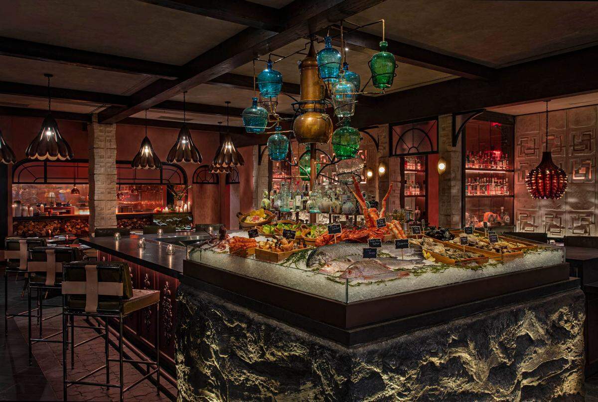 At the center of Como Como is the raw bar and a giant glass and copper “tequila tree.” We want to bask in its shade.
