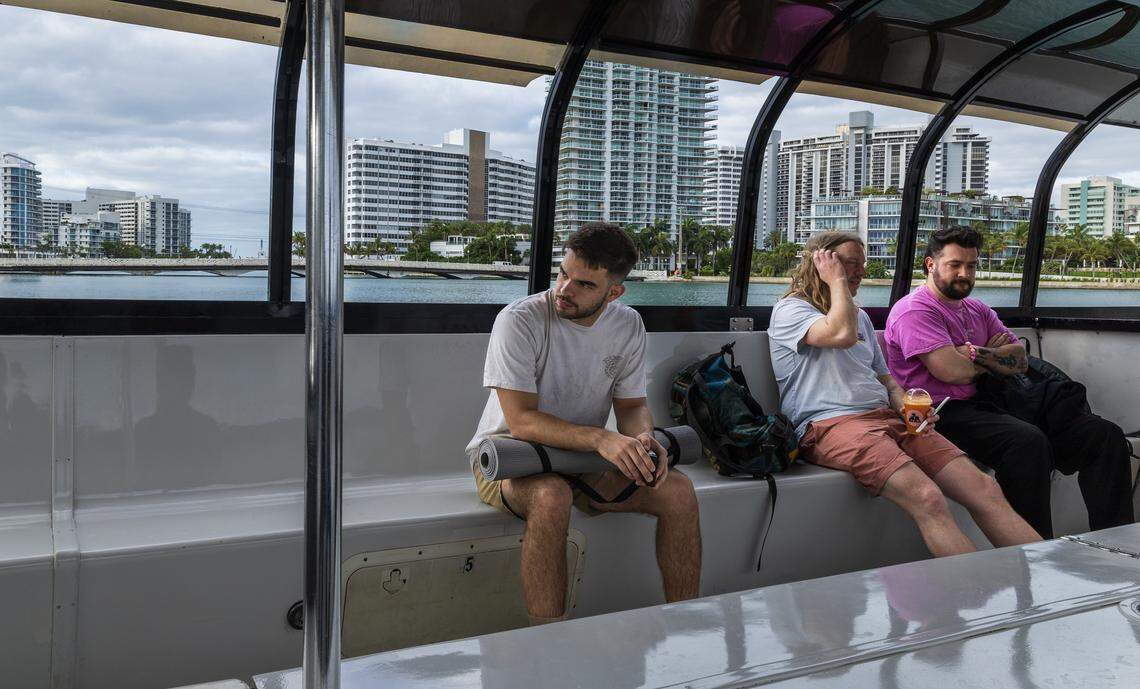 Passengers including Abraham Arias (far left) of Miami enjoy the ride aboard a vessel part of the free water taxi service established last January, between the Maurice Gibb Memorial Park in Miami Beach and the Venetian Marina and Yacht Club at North Bayshore Drive on the Miami side of Biscayne Bay, on Wednesday, April 15, 2026.
