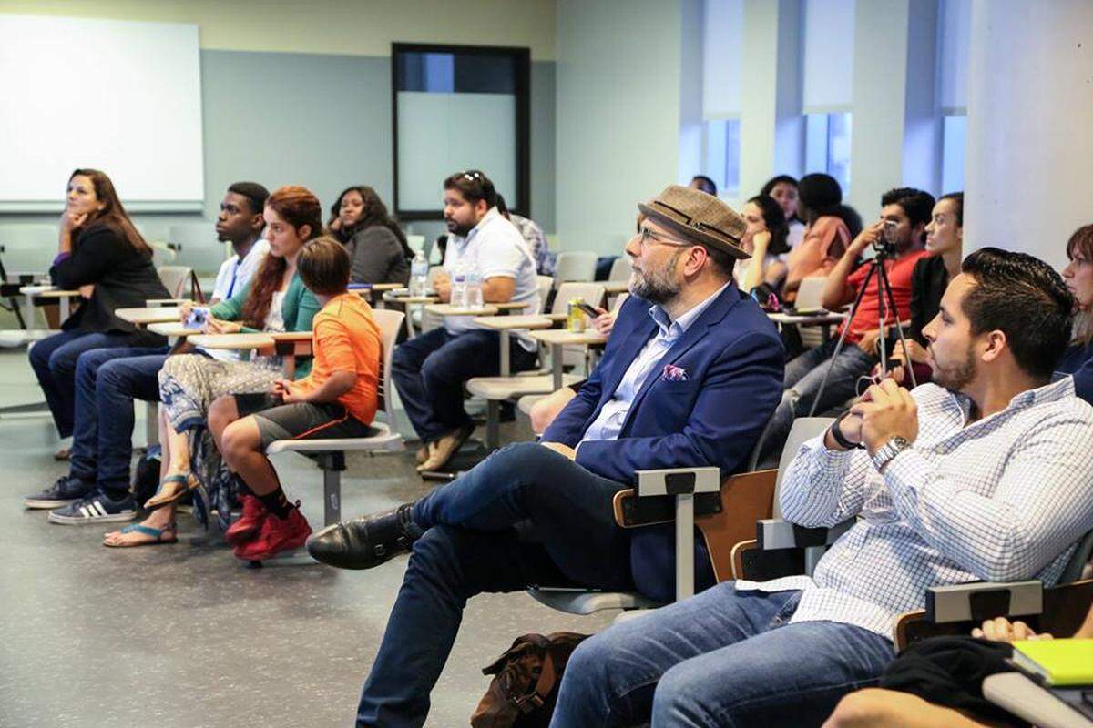 Students watch the winners of Miami Dade College’s Innovation Prize. Brizeyda Constantiny won $5,000 for “Baby Still on Board.”
