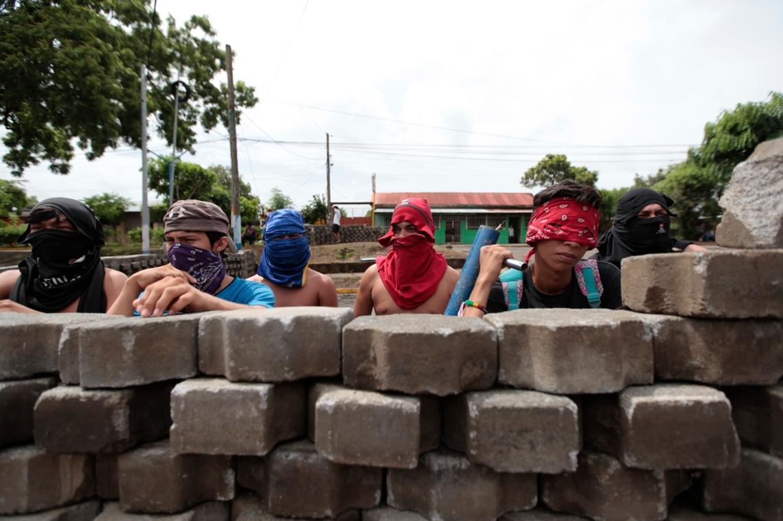 A group of protesters defend a barricade in the Fatima neighborhood in Masaya, Nicaragua, on June 6, 2018.